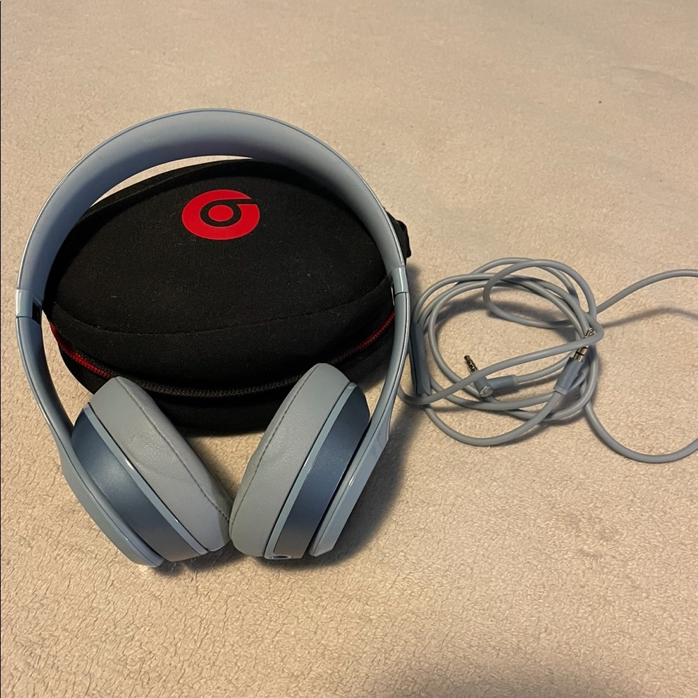 Blue wired Beats with case